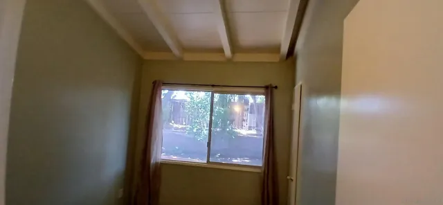 a bathroom with a shower and a mirror