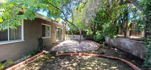 a backyard of a house with lots of green space