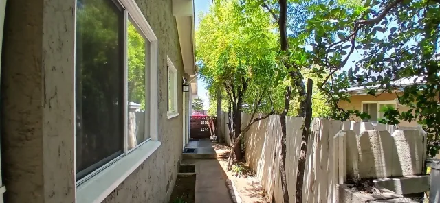 a kitchen with a sink a counter top space and refrigerator