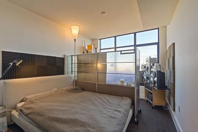 a bedroom with a bed and a walk in closet