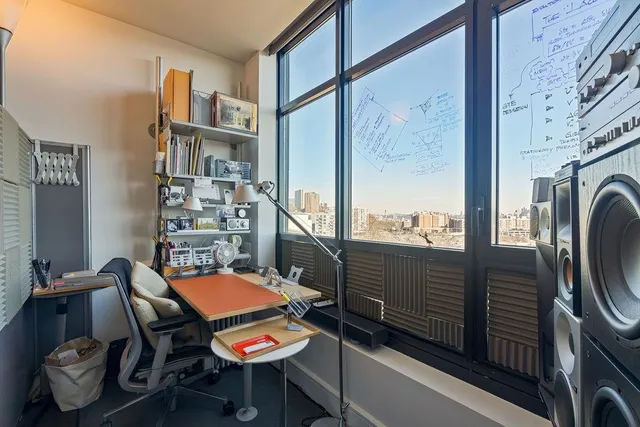 a view of a chairs and table in the balcony
