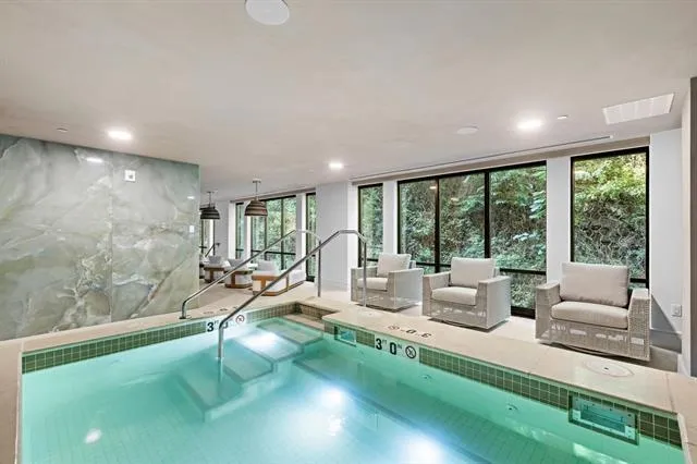 a very nice looking living room with a large window