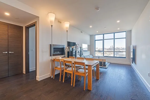 a view of a dining room with furniture window and wooden floor