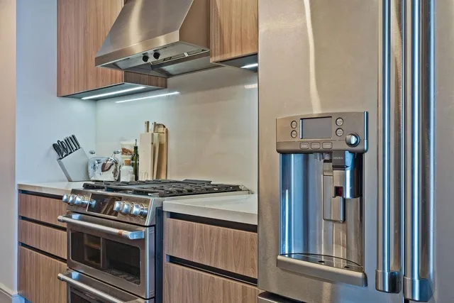 a kitchen with a stove and a refrigerator