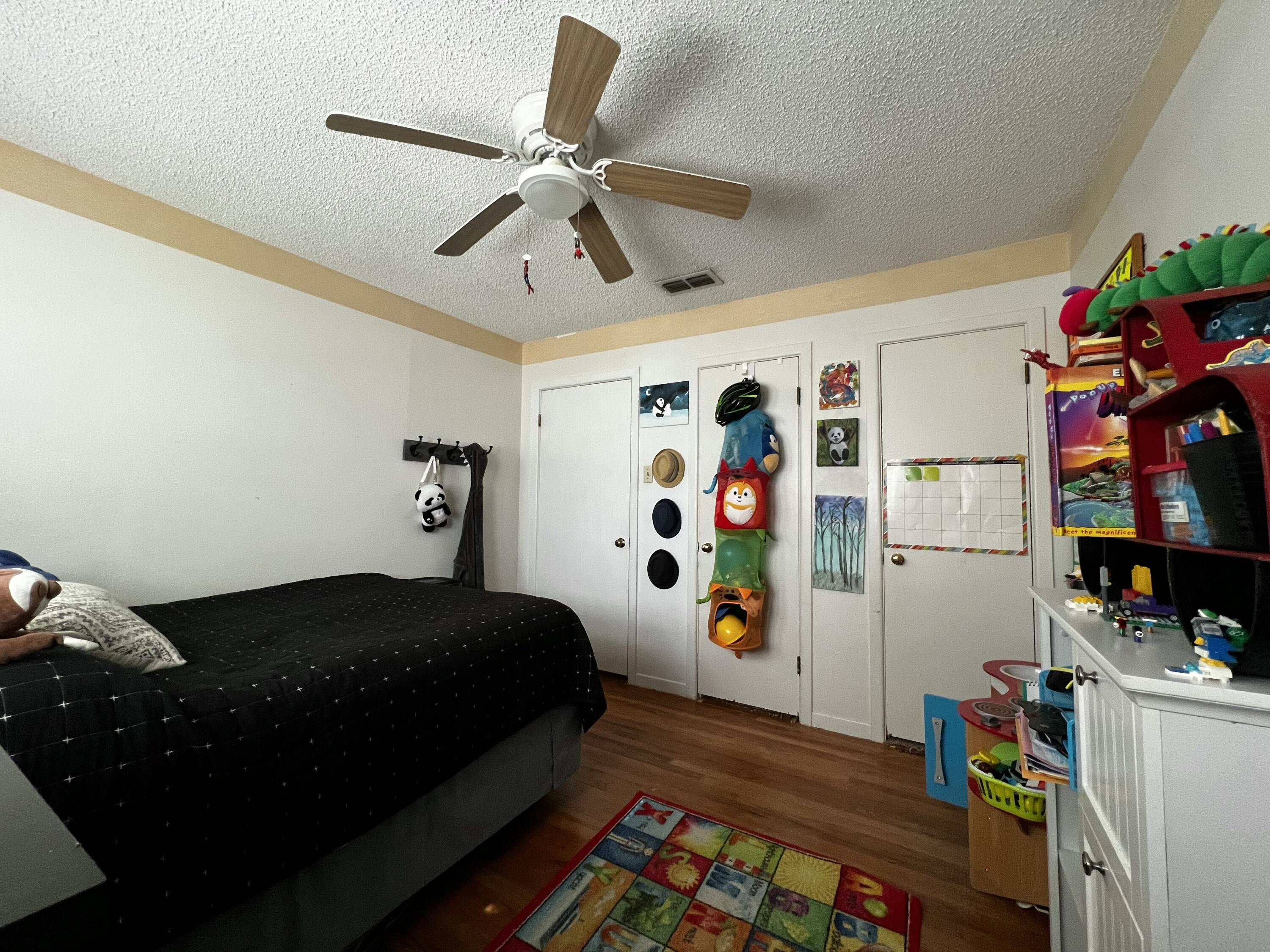 4520 36th Street Lubbock, TX 79414 - Photo 14 of 30 a bedroom with a bed and a window