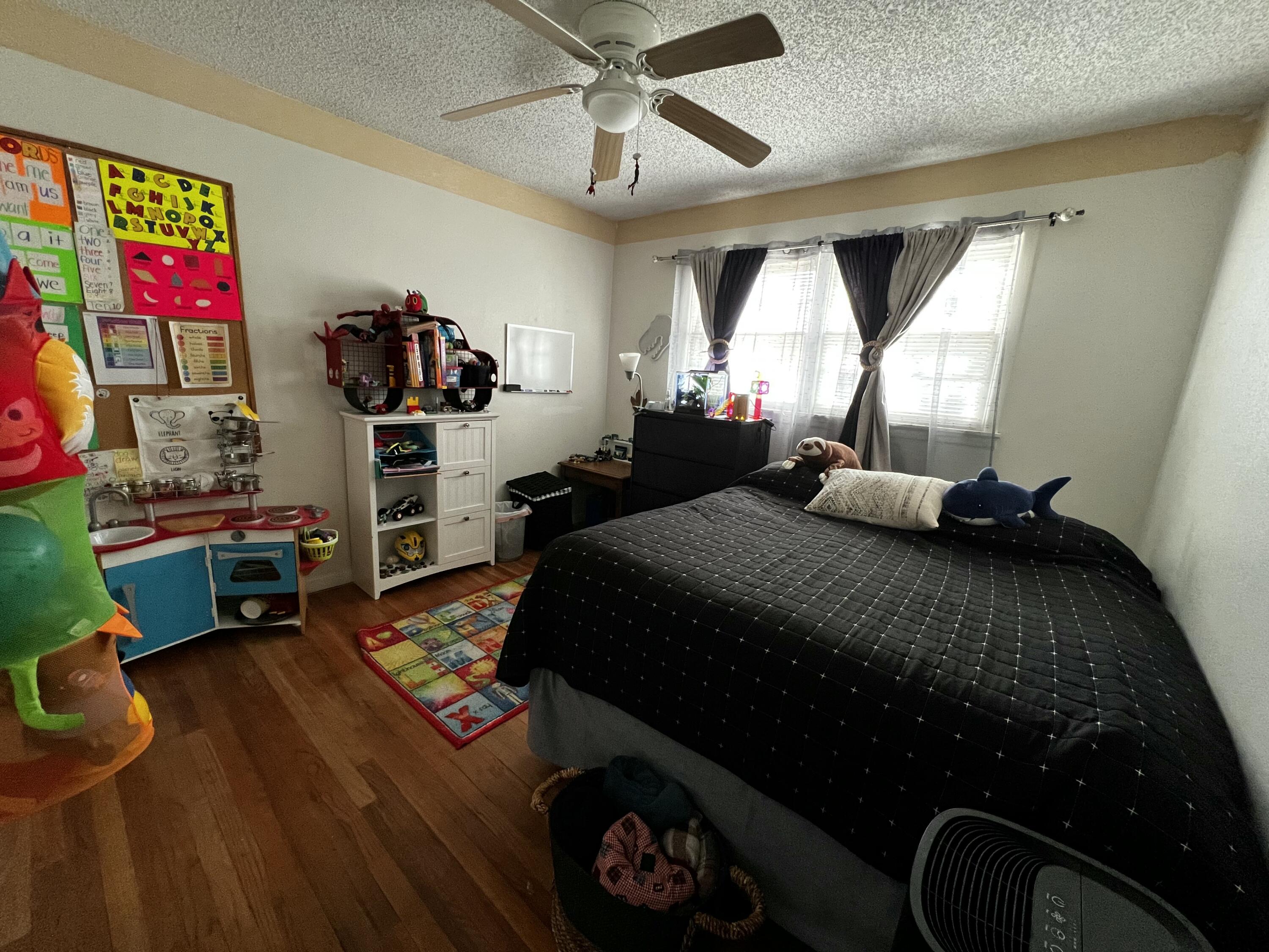 4520 36th Street Lubbock, TX 79414 - Photo 16 of 30 a bedroom with a bed and window