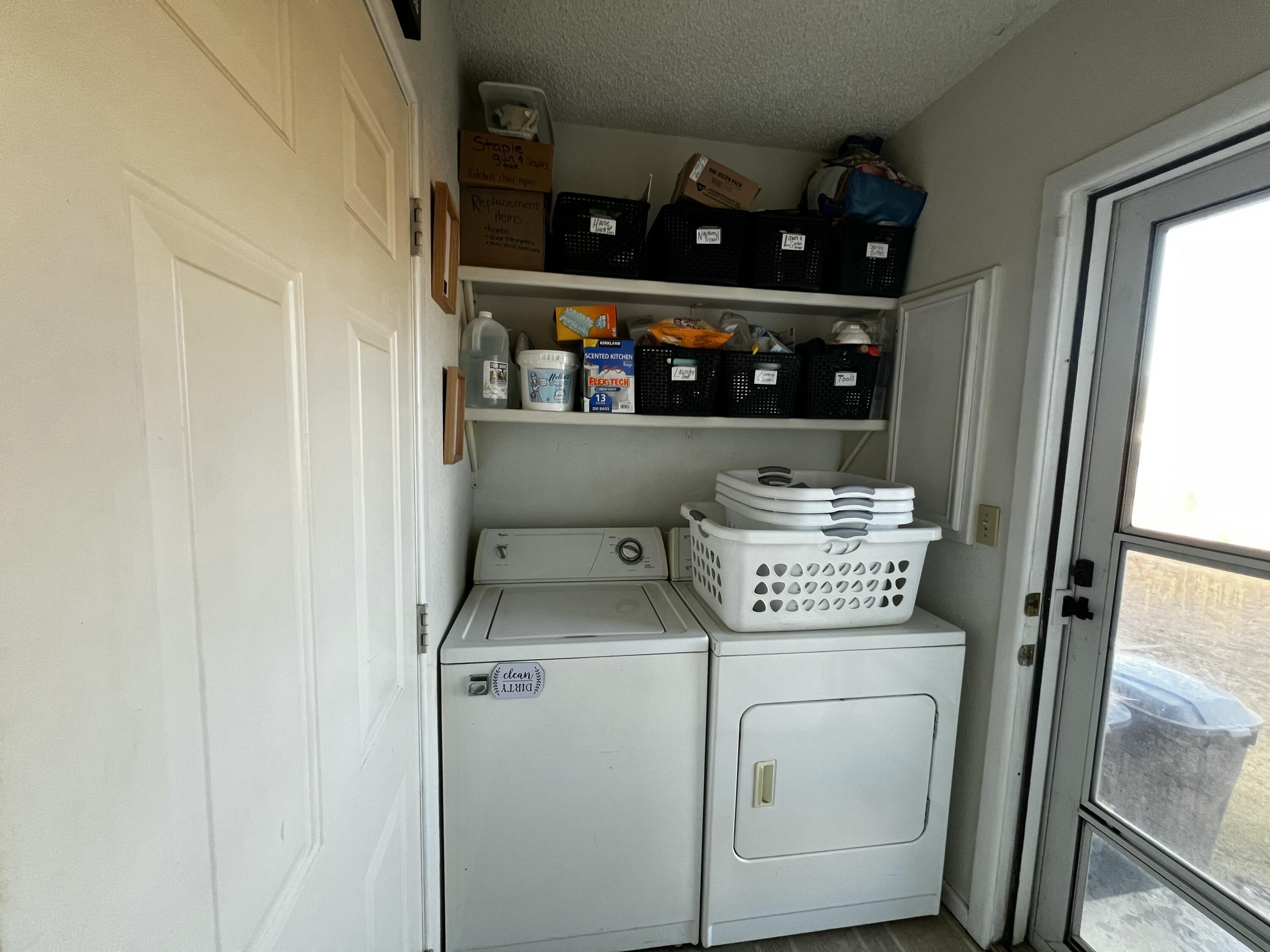 4520 36th Street Lubbock, TX 79414 - Photo 21 of 30 a utility room with dryer and washer