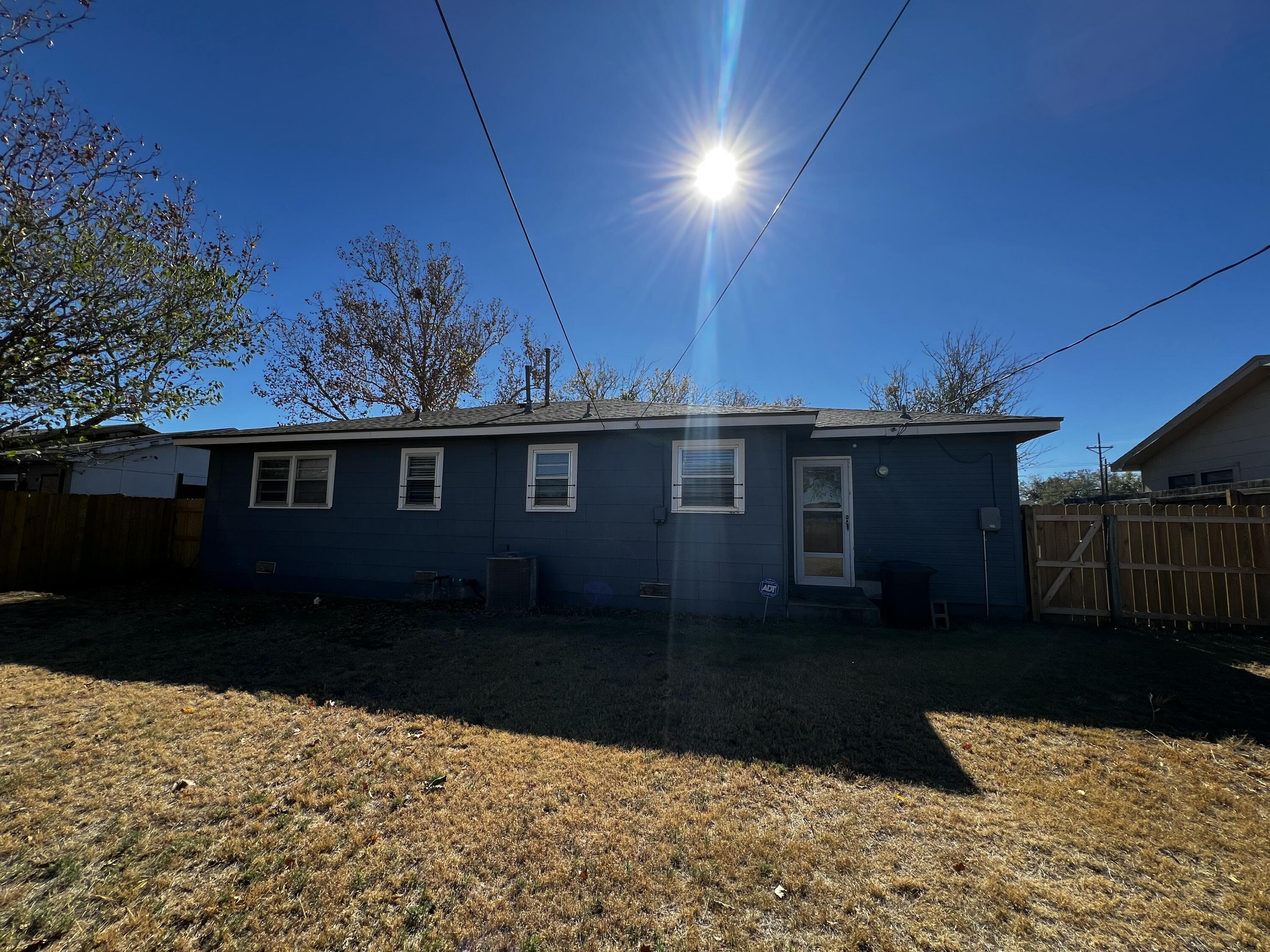 4520 36th Street Lubbock, TX 79414 - Photo 28 of 30 a front view of a house with a yard