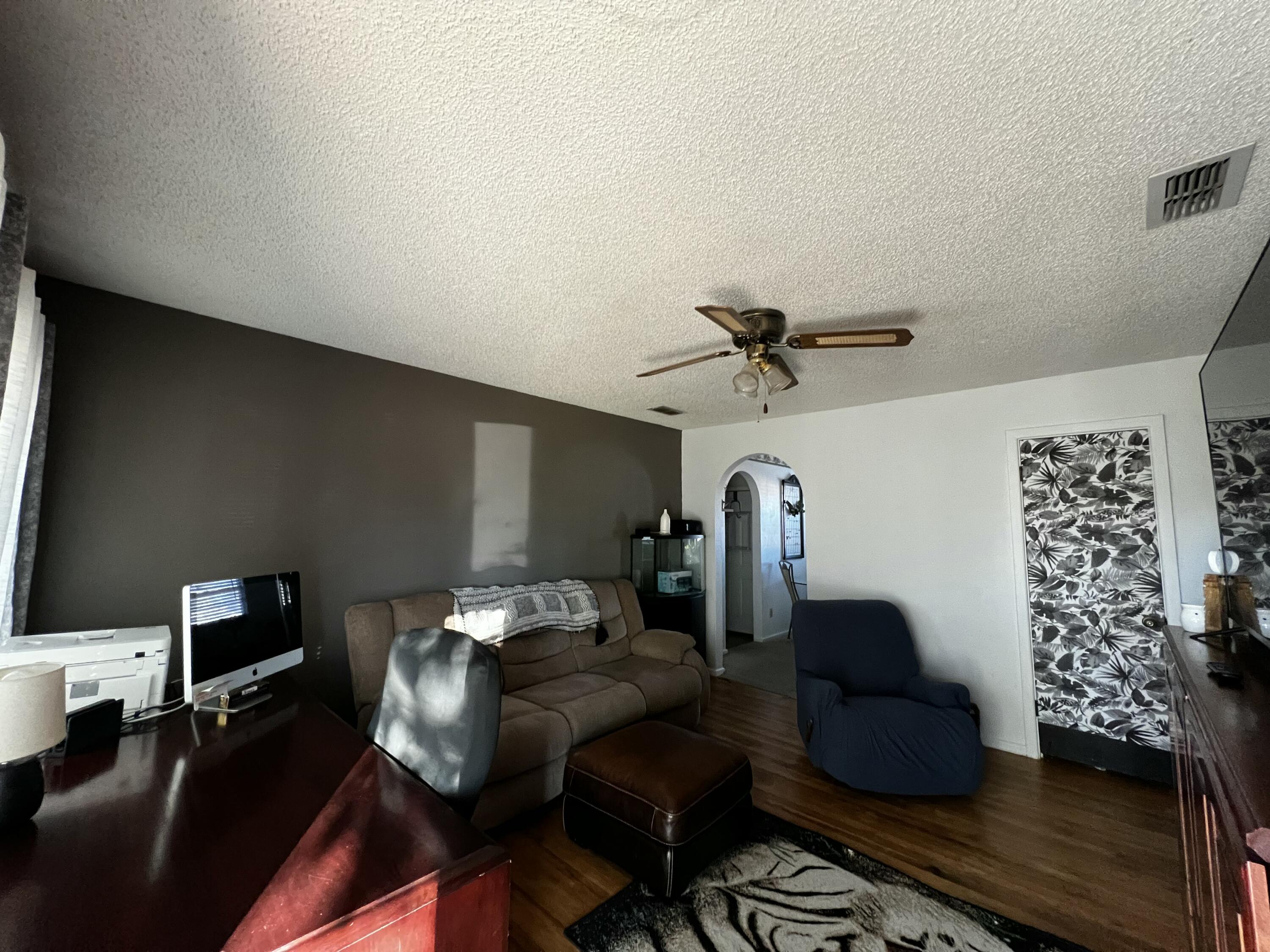 4520 36th Street Lubbock, TX 79414 - Photo 3 of 30 a living room with furniture and wooden floor