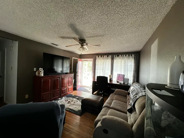 a kitchen with a sink a stove cabinets and refrigerator
