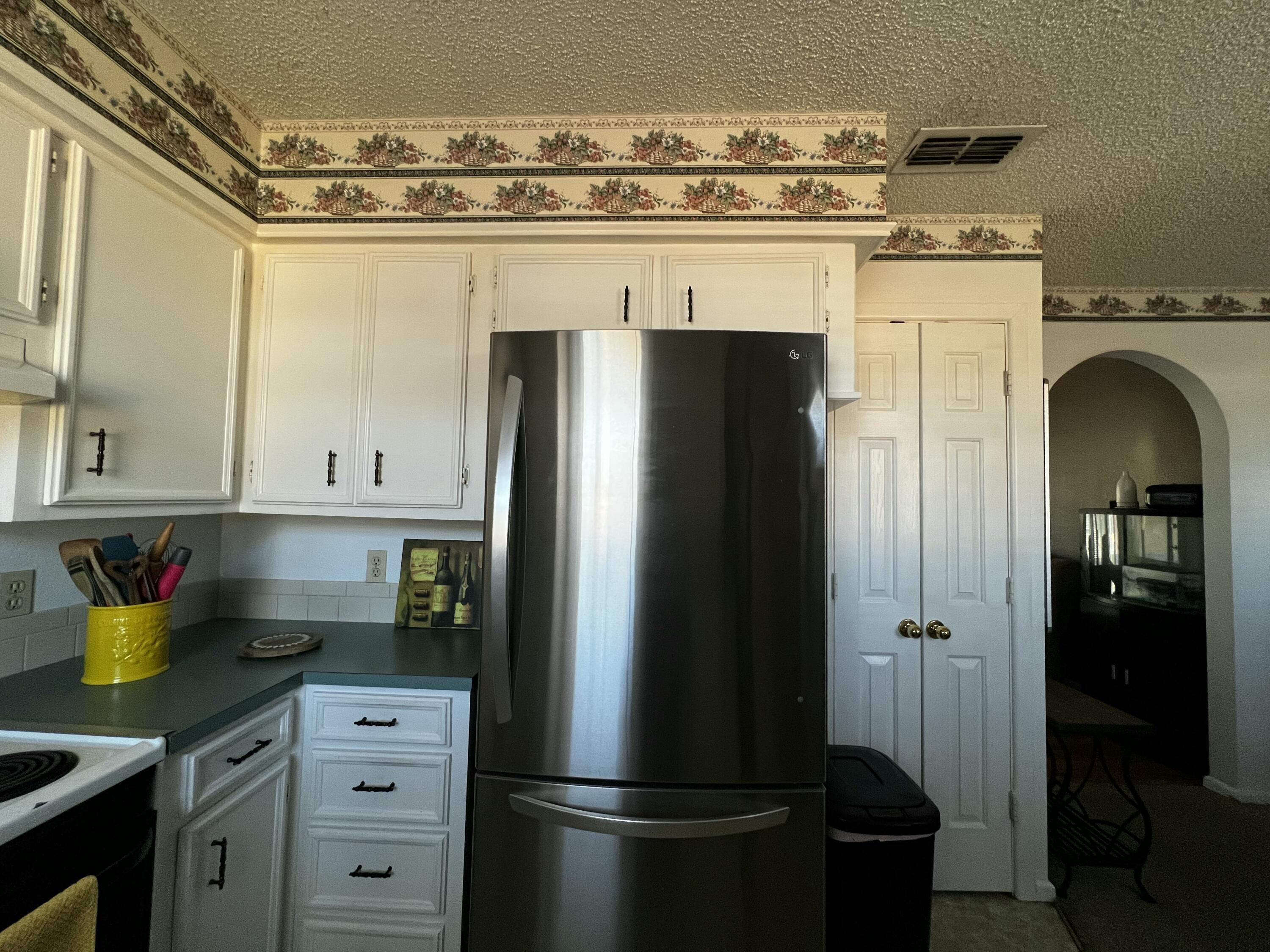 4520 36th Street Lubbock, TX 79414 - Photo 8 of 30 a kitchen with stainless steel appliances granite countertop a refrigerator and a stove