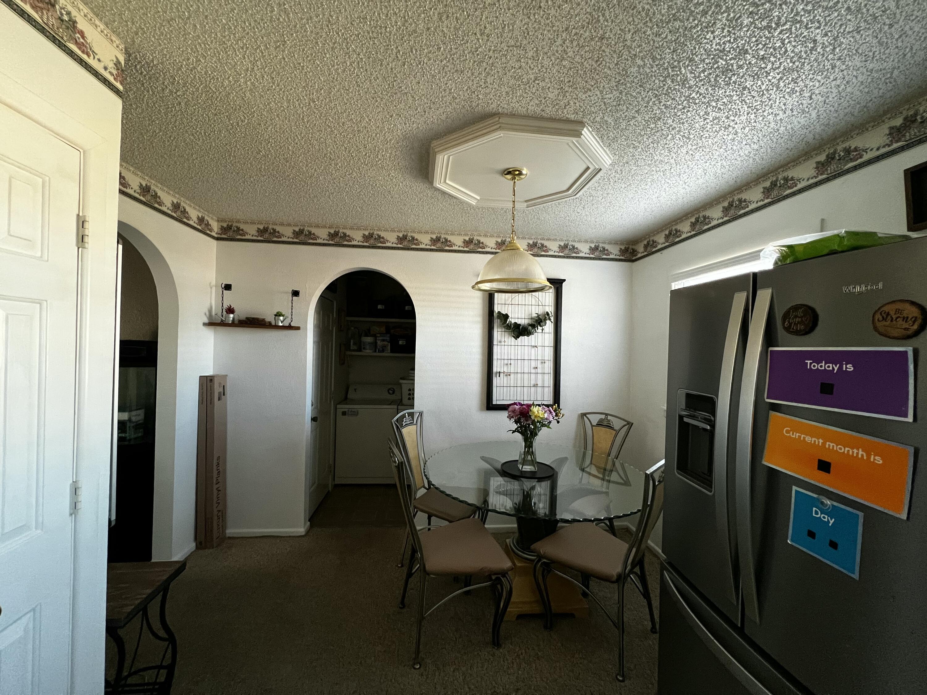 4520 36th Street Lubbock, TX 79414 - Photo 10 of 30 a view of a dining room with furniture and chandelier