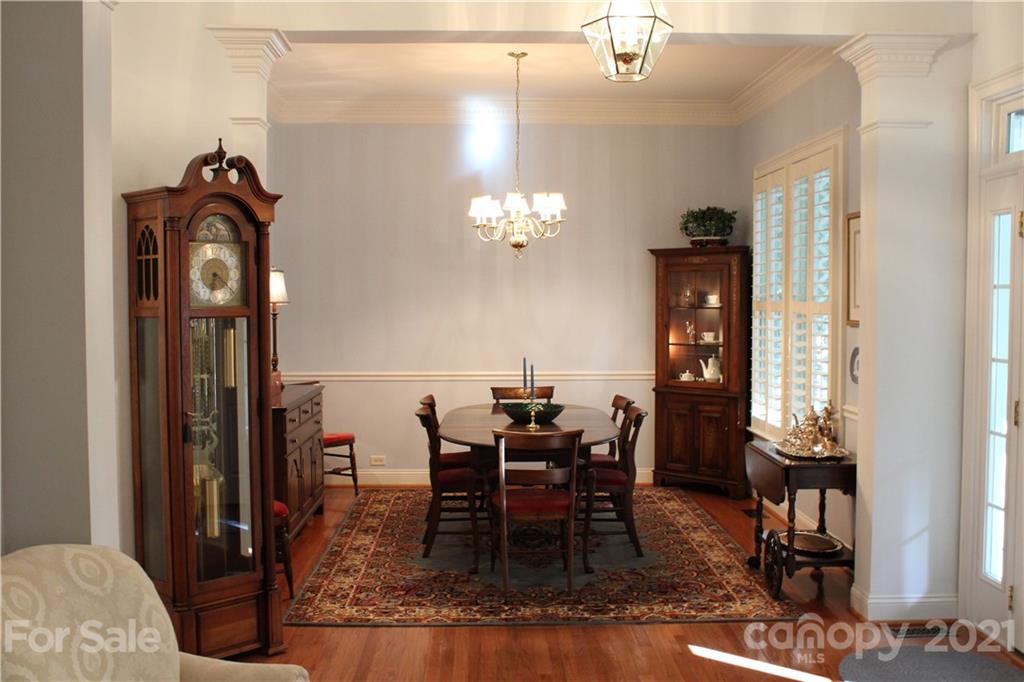 3022 Colonel Springs Way, Unit 171 Fort Mill, SC 29708 - Photo 7 of 30 a view of a dining room with furniture and chandelier
