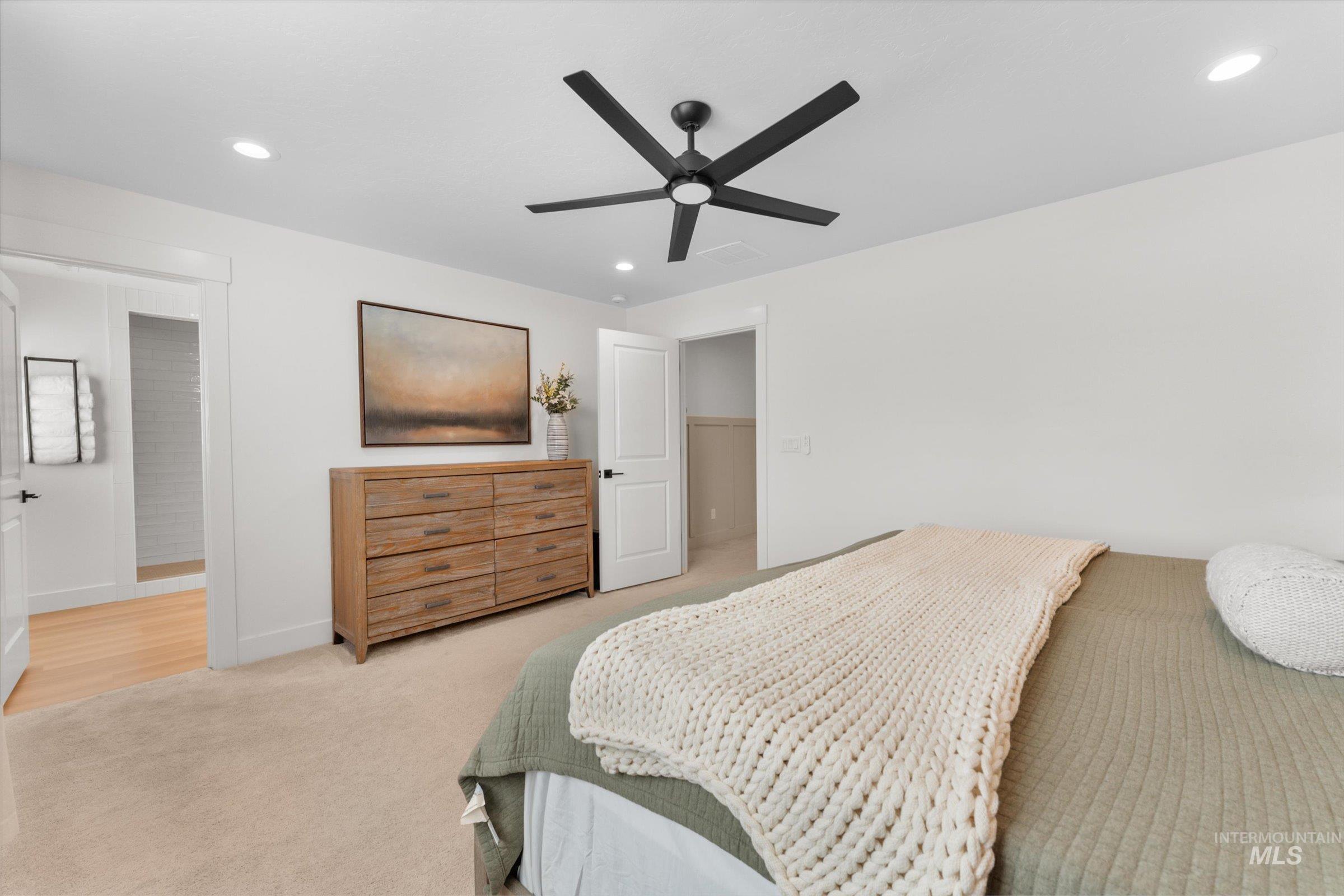 2172 Savoy Court Middleton, ID 83644 - Photo 18 of 46 Bright bedroom featuring neutral-toned carpeting and white walls