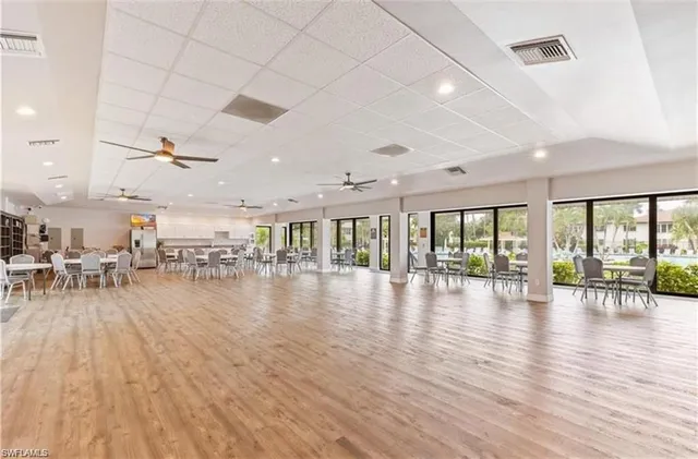 a view of a living room and hall with wooden floor