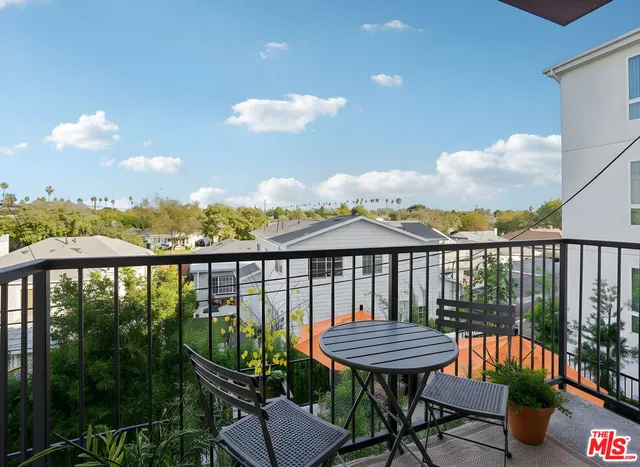a view of a balcony with a bench