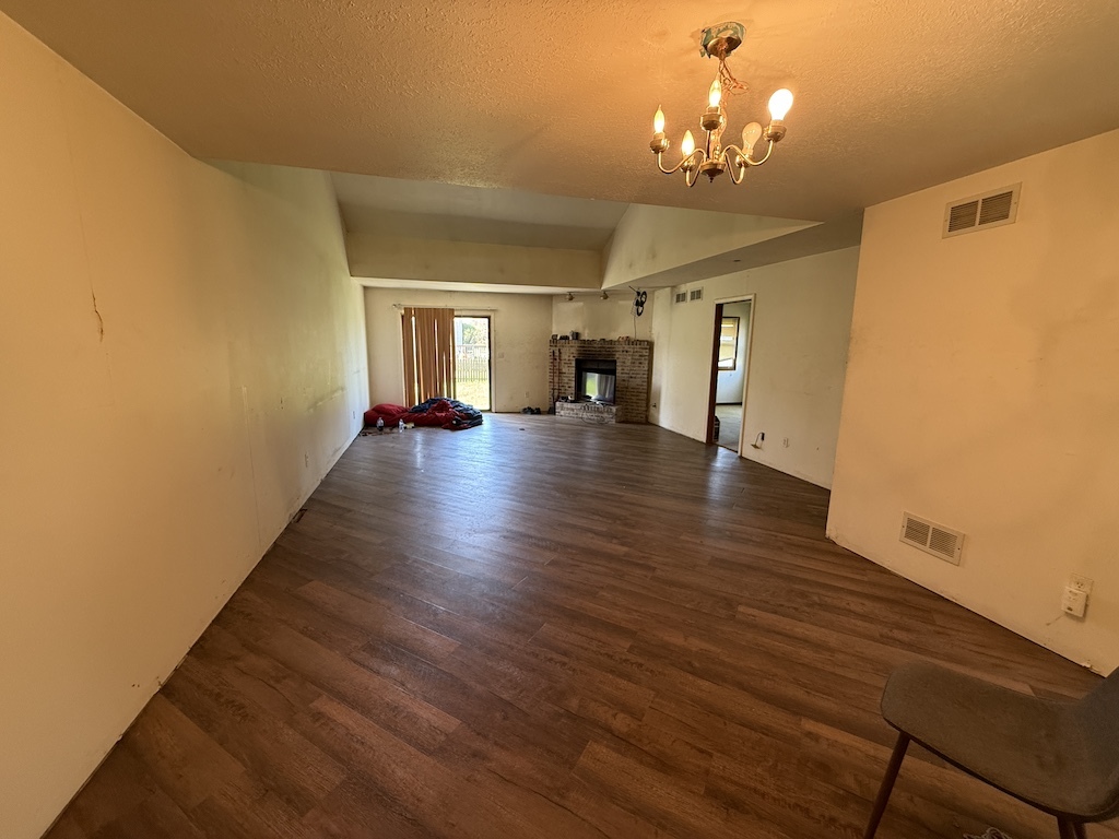 109 Ravinia Drive Shorewood, IL 60404 - Photo 3 of 14 a view of a room with wooden floor and windows