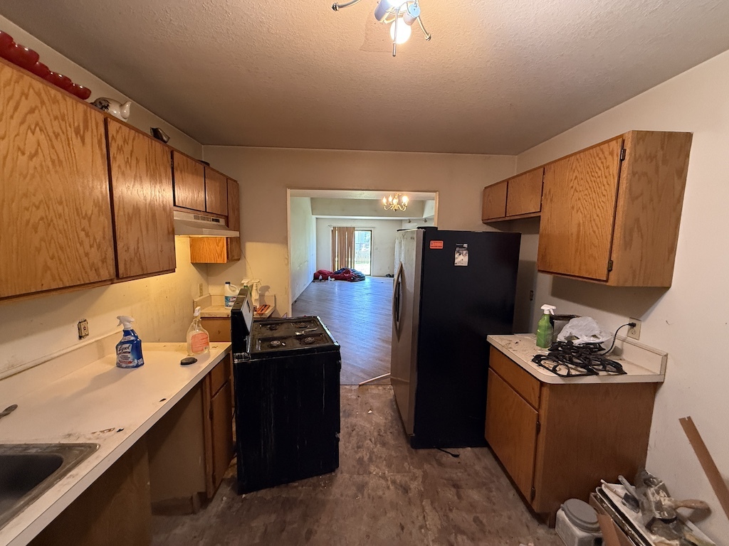 109 Ravinia Drive Shorewood, IL 60404 - Photo 5 of 14 a kitchen with stainless steel appliances kitchen island granite countertop a refrigerator and a stove top oven