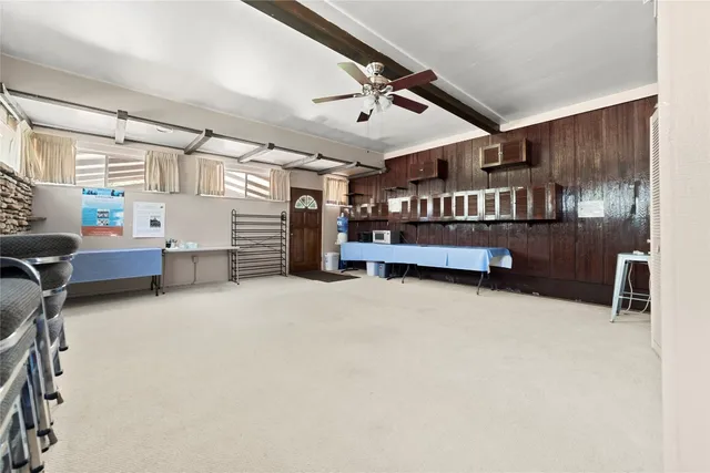 a view of a livingroom with furniture and a window
