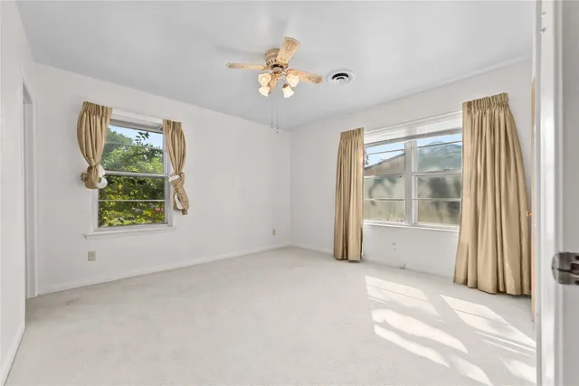 a bathroom with a sink toilet and a mirror