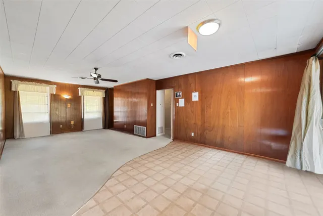 a large room with windows and closet