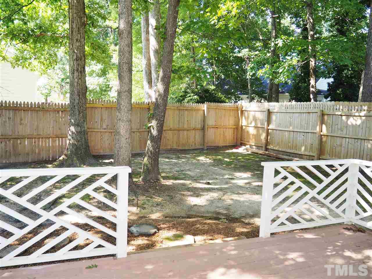 608 Maylands Avenue Raleigh, NC 27615 - Photo 13 of 14 a backyard of a house with a street view