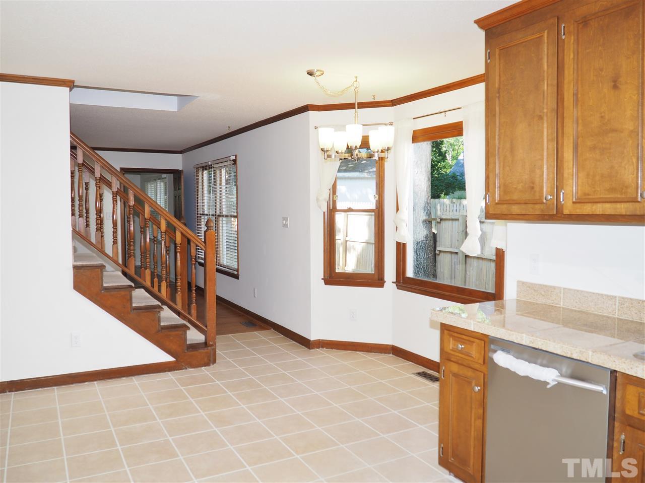608 Maylands Avenue Raleigh, NC 27615 - Photo 7 of 14 a view of an entryway with wooden floor and door
