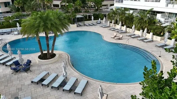a view of swimming pool with outdoor seating