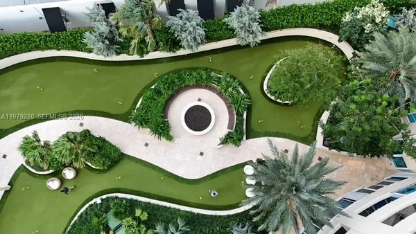 a view of a swimming pool with a lounge chair