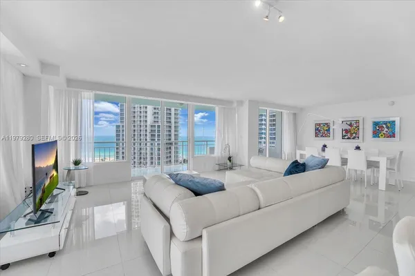 a living room with furniture and a large window