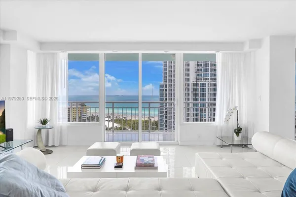 a living room with furniture white walls and white walls