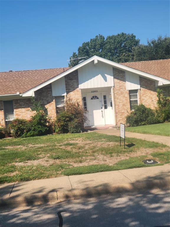 12911 Mitchwin Road Farmers Branch, TX 75234 - Photo 2 of 38 Ranch-style house featuring brick siding, a porch, a front yard, and roof with shingles