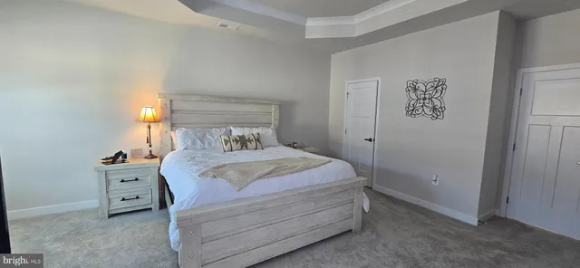 a bathroom with a granite countertop shower a toilet and a sink