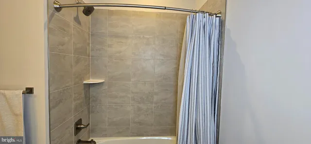 a bed room with a bed and a window