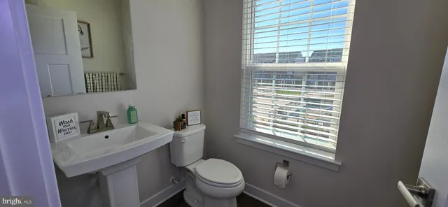 a view of kitchen with cabinets and wooden floor
