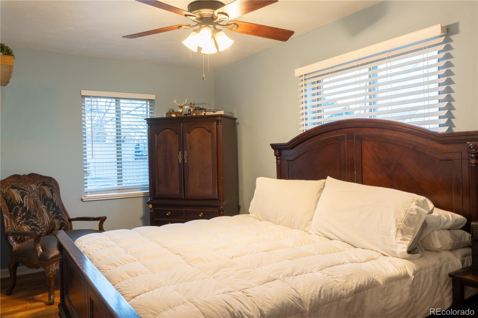 695 South Bryant Street Denver, CO 80219 - Photo 16 of 28 a bedroom with a bed and window