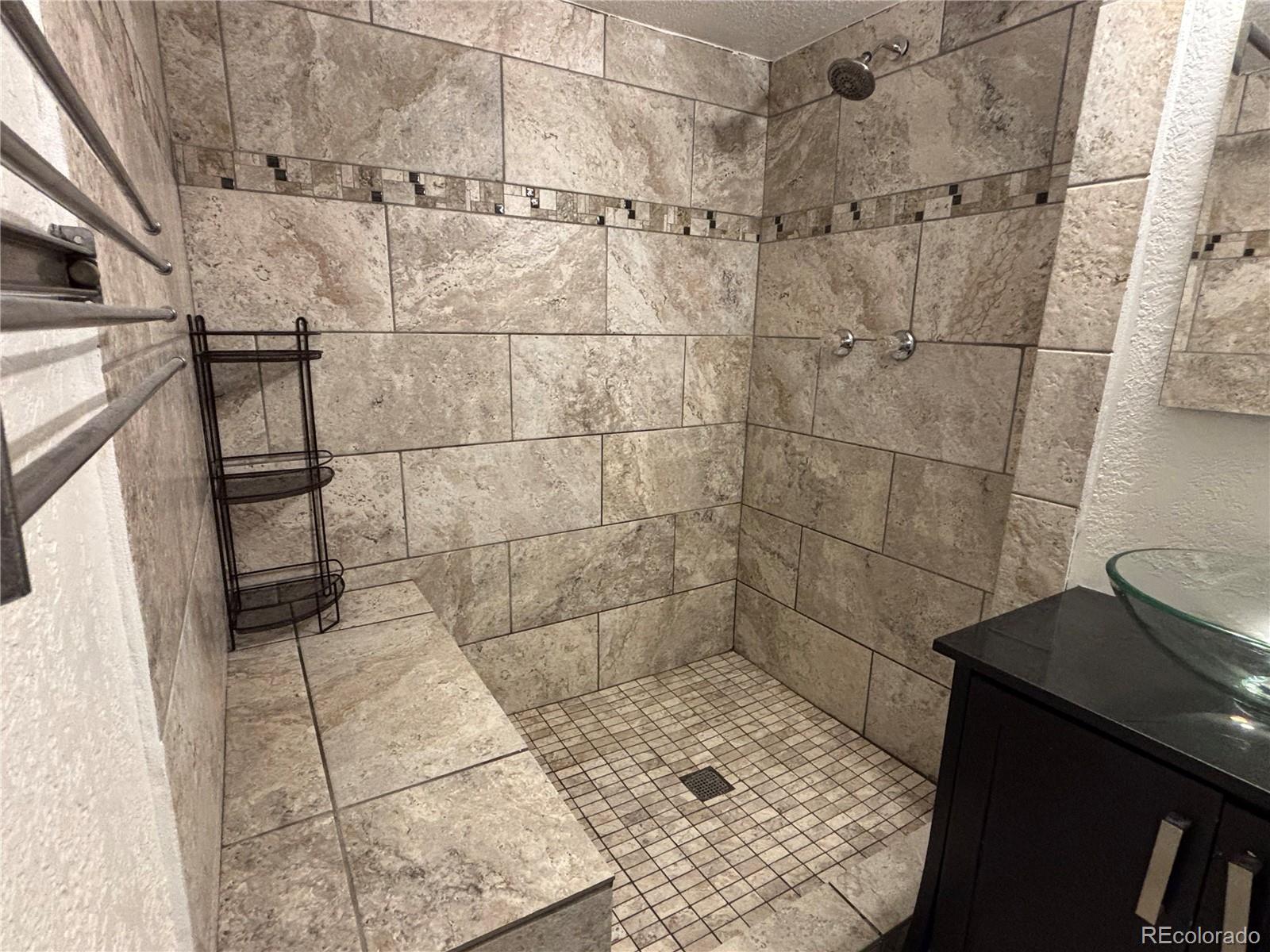 695 South Bryant Street Denver, CO 80219 - Photo 24 of 28 a bathroom with a shower