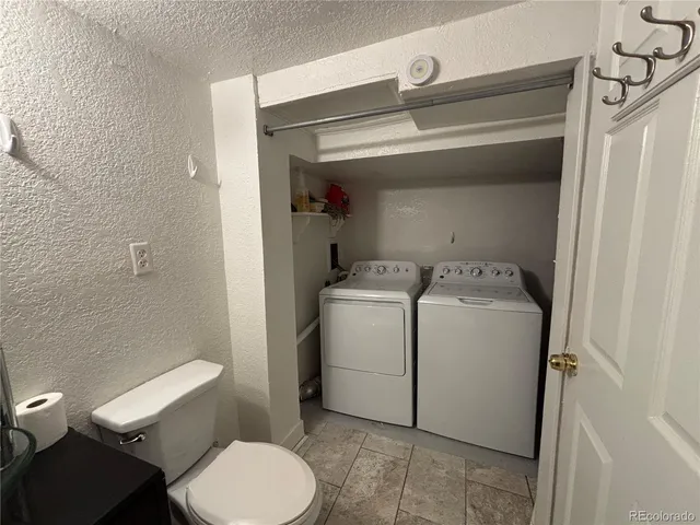 a bathroom with a toilet and a vanity