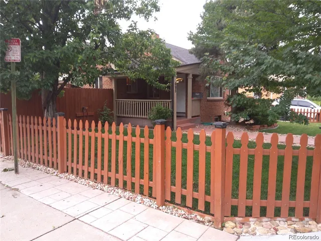 a street view that has wooden fence