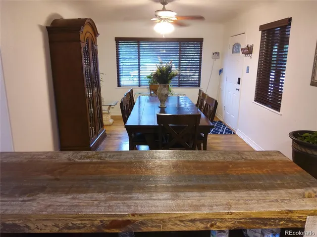 a view of kitchen with furniture and wooden floor