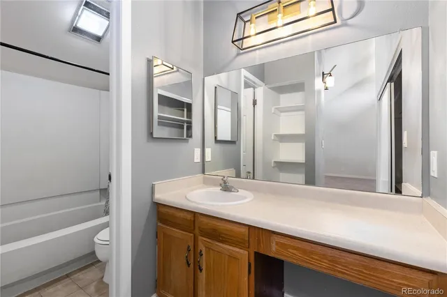 a bathroom with a sink a toilet and a bathtub