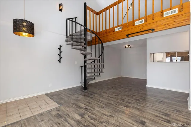 a view of an entryway with wooden floor