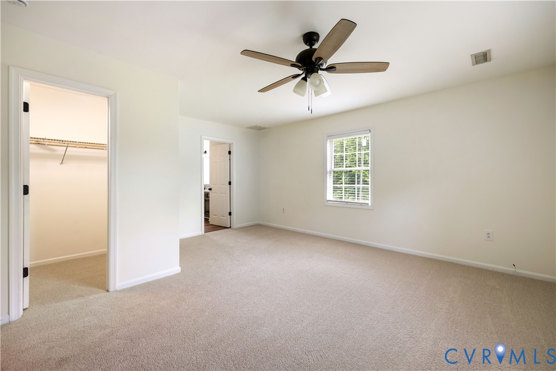 5 Walters Way Bumpass, VA 23024 - Photo 11 of 28 a view of a livingroom with a ceiling fan and window