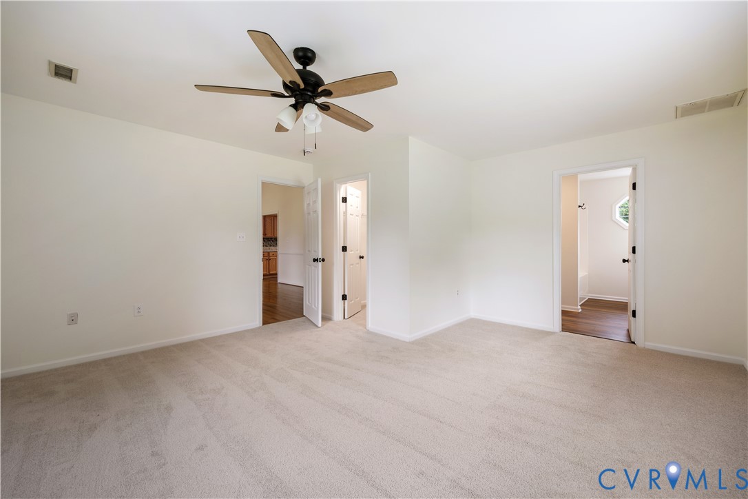 5 Walters Way Bumpass, VA 23024 - Photo 12 of 28 an empty room with closet and a chandelier fan