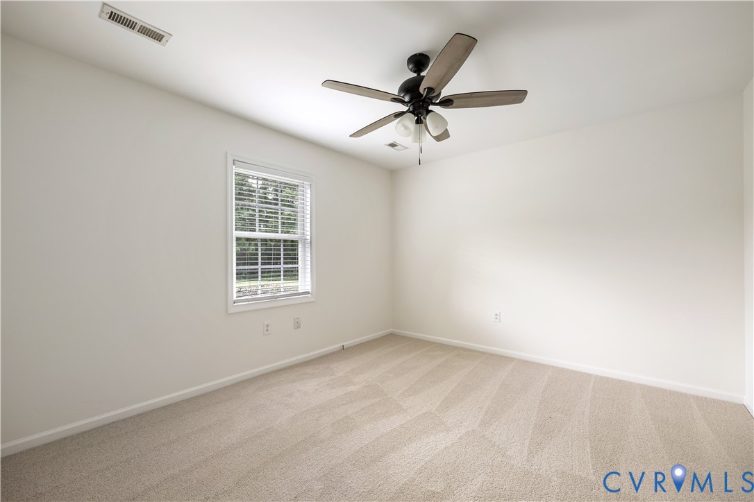 5 Walters Way Bumpass, VA 23024 - Photo 15 of 28 a view of a big room with wooden floor closet and windows