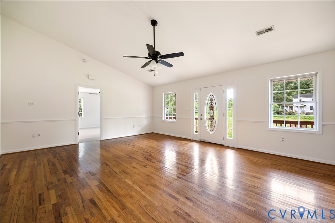 5 Walters Way Bumpass, VA 23024 - Photo 5 of 28 a view of an empty room with window and wooden floor