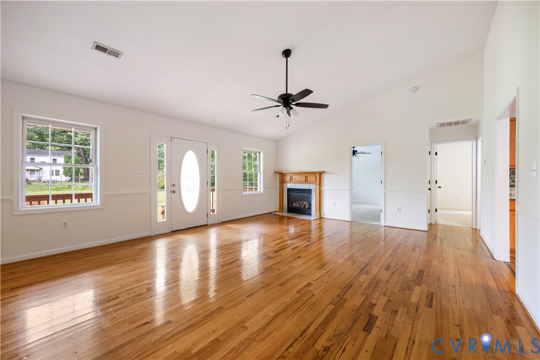 5 Walters Way Bumpass, VA 23024 - Photo 7 of 28 a view of empty room with wooden floor and fireplace