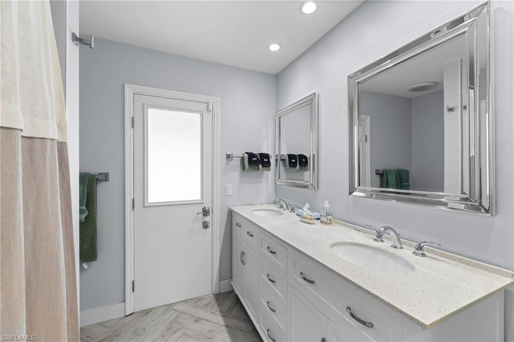2467 Pinewoods Circle, Unit 3 Naples, FL 34105 - Photo 32 of 33 Bathroom with vanity
