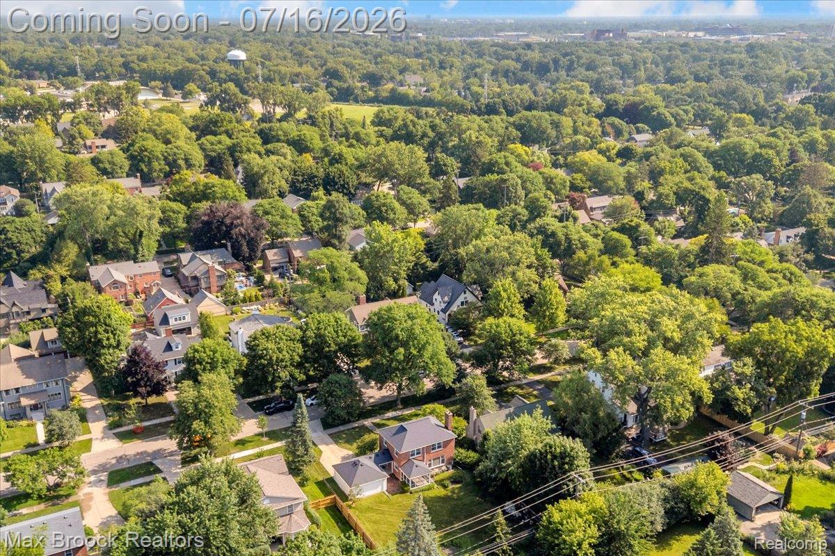 1292 Yorkshire Road Birmingham, MI 48009 - Photo 41 of 47 Expansive aerial perspective showcasing a residential area characterized by abundant mature trees and a mix of traditional and contemporary home styles