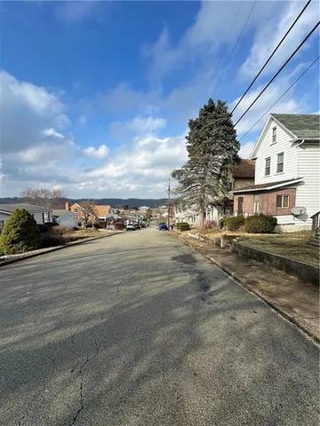 a kitchen with cabinets window and sink